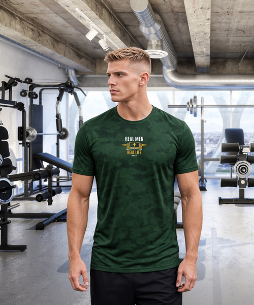 Focused man in modern gym wearing RMRL Emerald Green Camo Dry-Fit Tee with Real Men Real Life center-chest logo