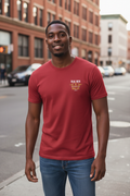 Man on urban street wearing cardinal red RMRL Core Identity Collection tee with bold center-chest Real Men Real Life logo