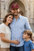 Caucasian man with family on church steps wearing solid burgundy RMRL Core Identity Cap